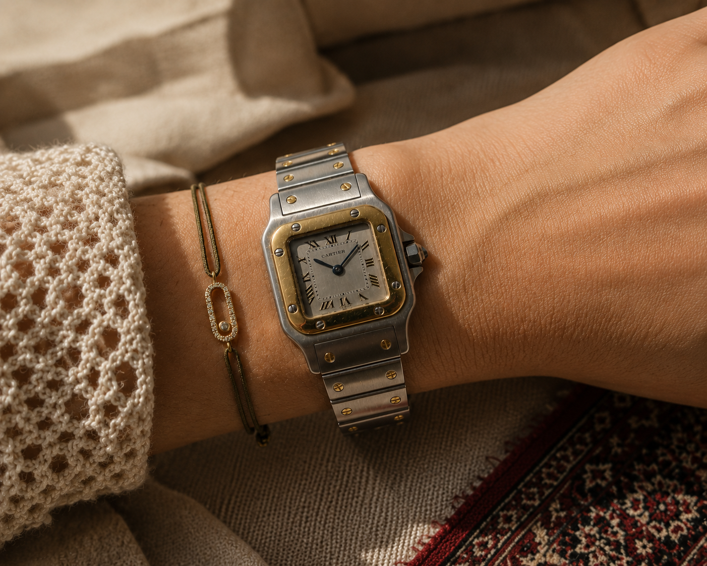 Gold and steel Cartier Santos Galbée worn on the wrist